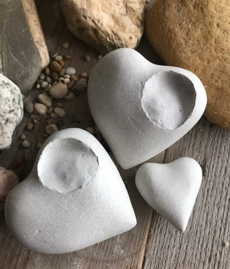 Finger printed heart light holder cast with cremated remains. An example of bespoke keepsake of ashes, keeping someone close and present as we adjust to life living with loss