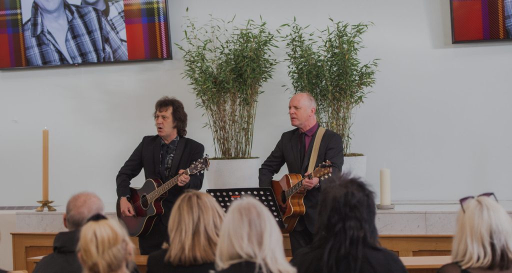 Live musicians performing during a personalised cremation ceremony in a chapel