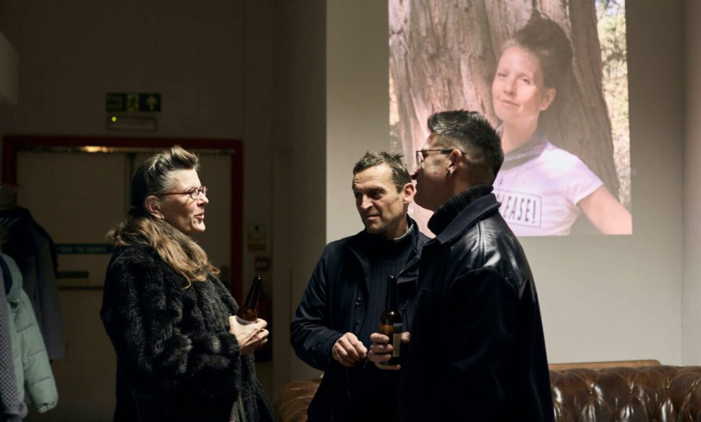 Guests talking quietly at a memorial event