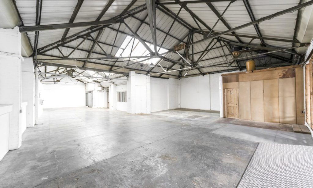 MKII-warehouse studio space with high iron girder ceilings for contemporary personal funerals