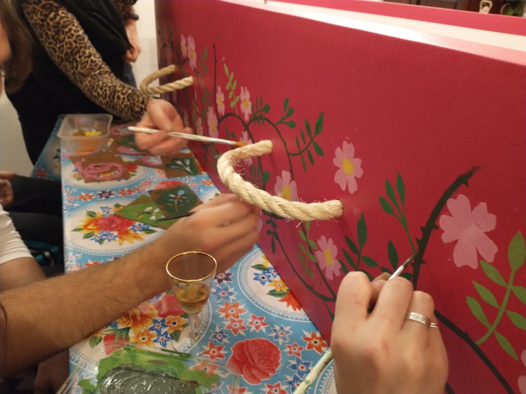 Hand painting of a pink cardboard coffin