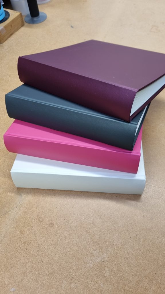 Luxury Jewel cover Memory & Condolence books from Begolden in white, bright pink , slate and deep purple colours