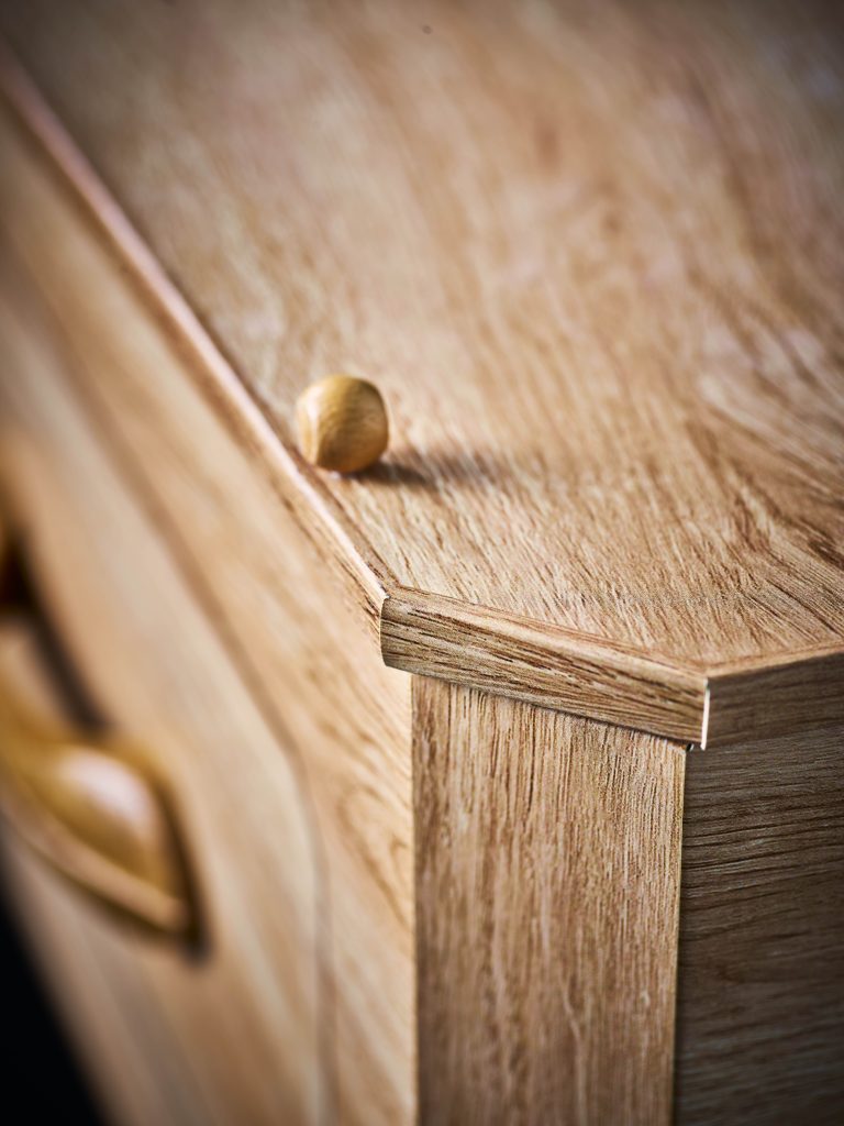 Premium forest board wood effect cardboard coffin close up