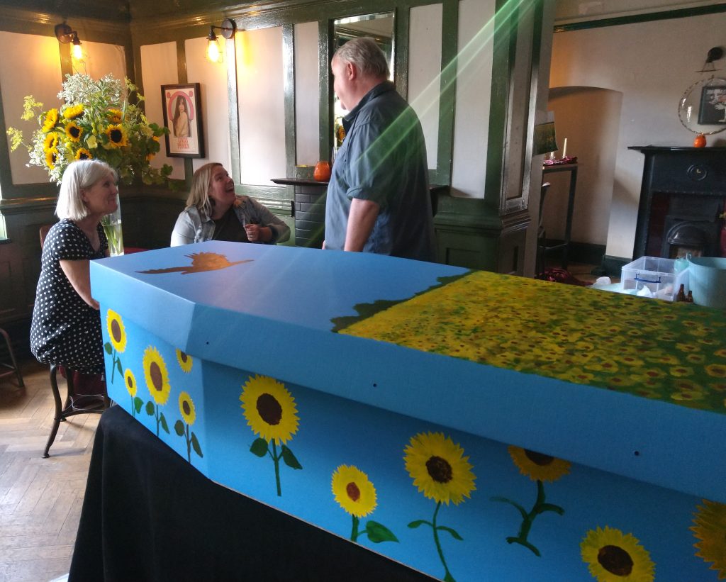 Hand decorated coffin using stensils