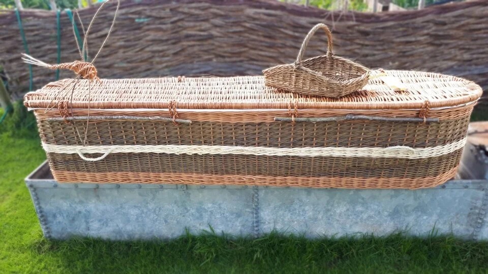 Brown willow coffin with natural trim