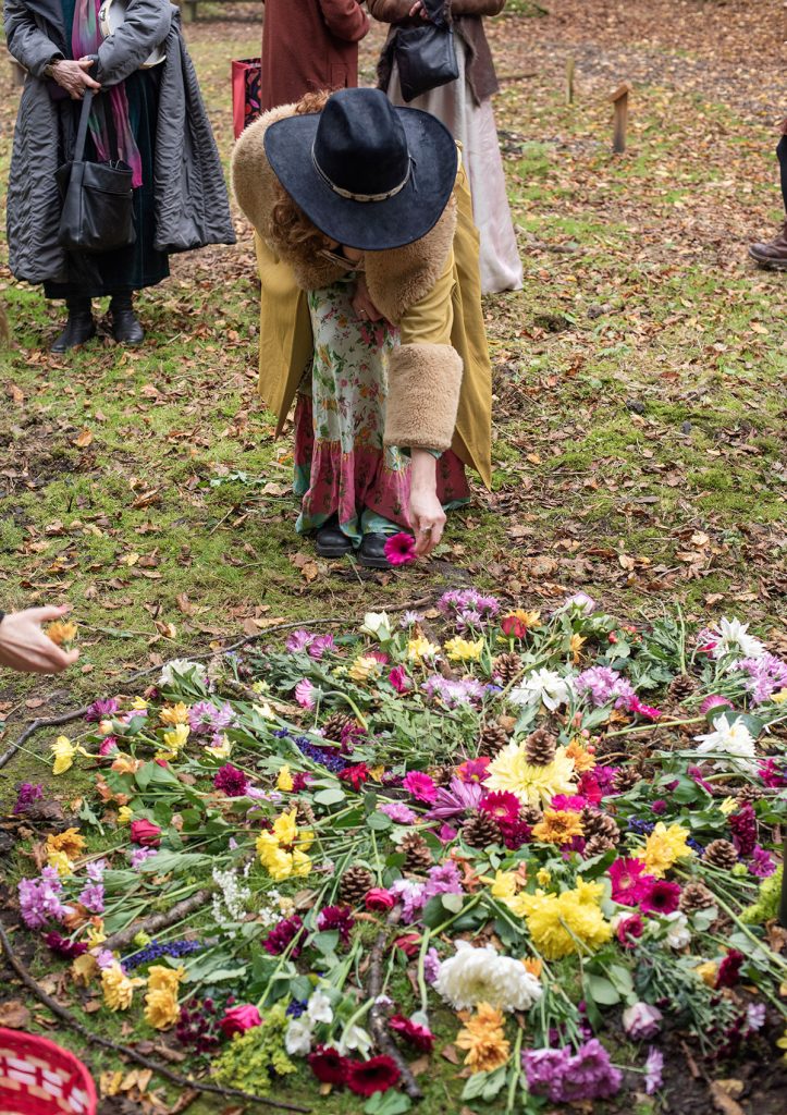 The ritual of a mandala of flowers in the natural burial ground, Green Acres Epping