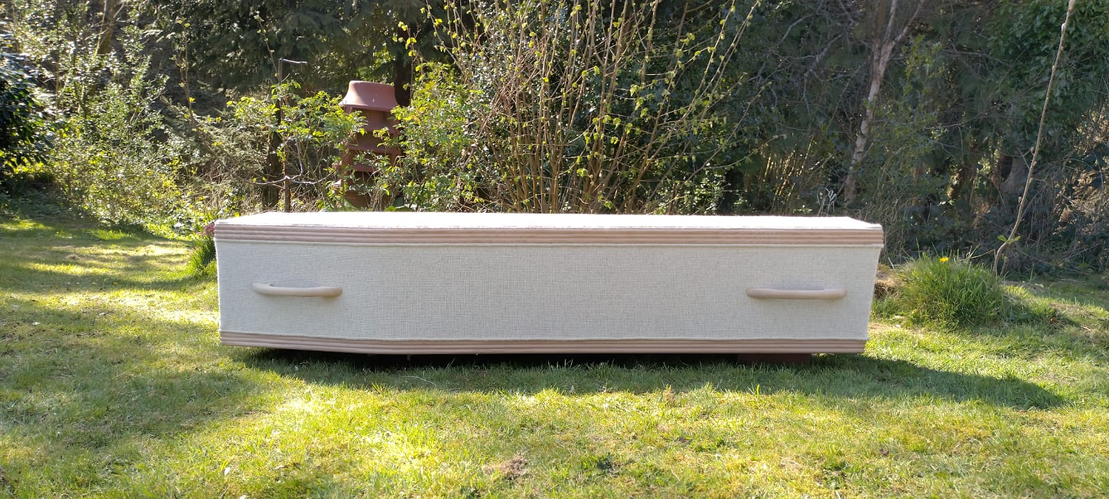 British Woollen sustainable coffin by The Woollen Cwtch Company, natural colour wool bathed in sunlight