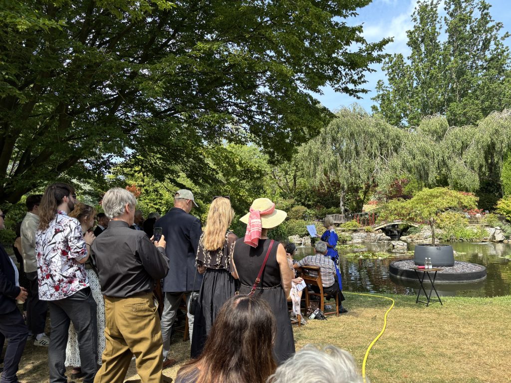 Alternative Cremation funeral ceremony, outside in the gardens at Golders Green Crematorium