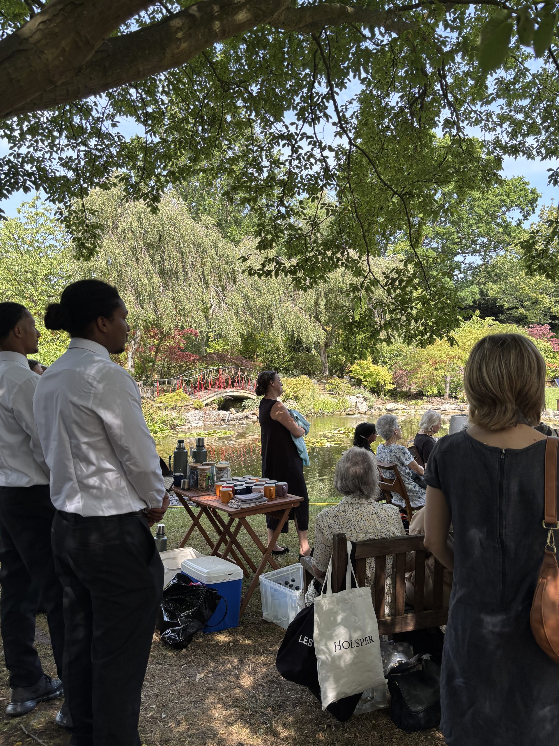 Alternative cremation ceremony, waterside in the gardens at Golders Green Crematorium with funeral refreshments